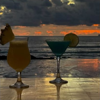 Cocktails overlooking the sunset at Tienhomm